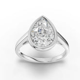 Pear-cut bezel ring in white gold