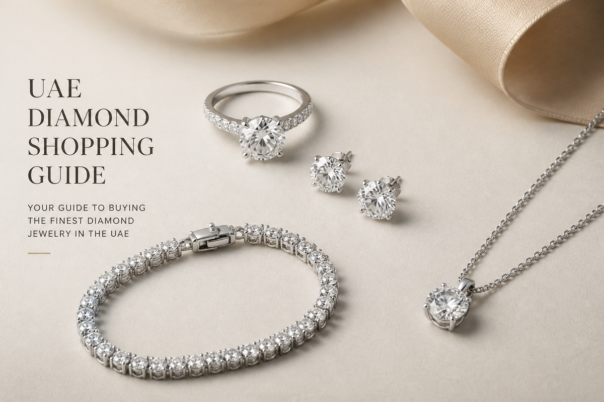 Diamond ring, diamond earrings, diamond bracelet, and diamond pendant arranged on a neutral surface