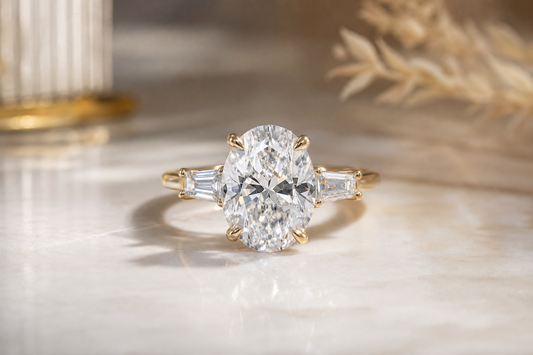 Close-up of a lab diamond ring on a neutral surface with soft lighting