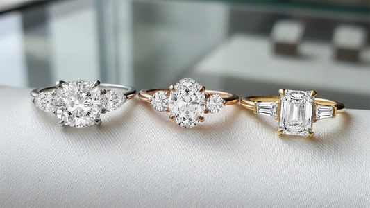 three-stone rings showing ideal center-to-side stone ratio for balanced sparkle
