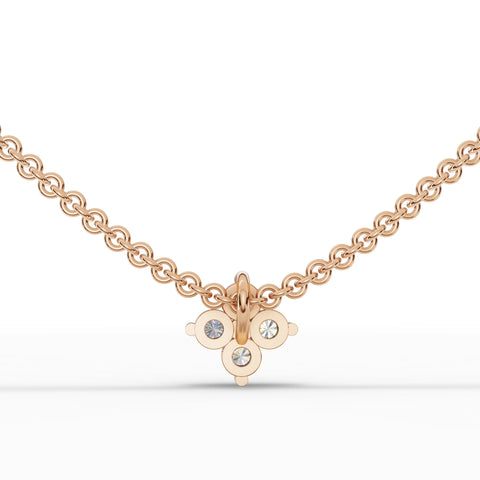 Floral lab diamond pendant with four round brilliant diamonds, set in polished 18k gold on a delicate chain.