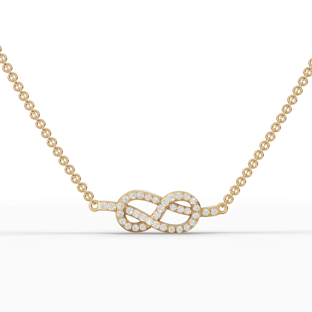Delicate 18k gold pendant featuring an infinity and heart design, adorned with pavé-set round lab diamonds.