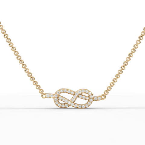 Delicate 18k gold pendant featuring an infinity and heart design, adorned with pavé-set round lab diamonds.