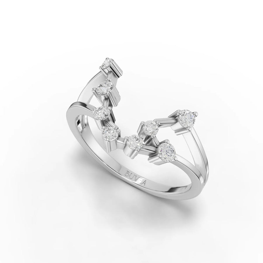 Sculptural 18k gold ring featuring 0.24 Ct round lab grown diamonds in an open dual-band design inspired by the Aquarius constellation.