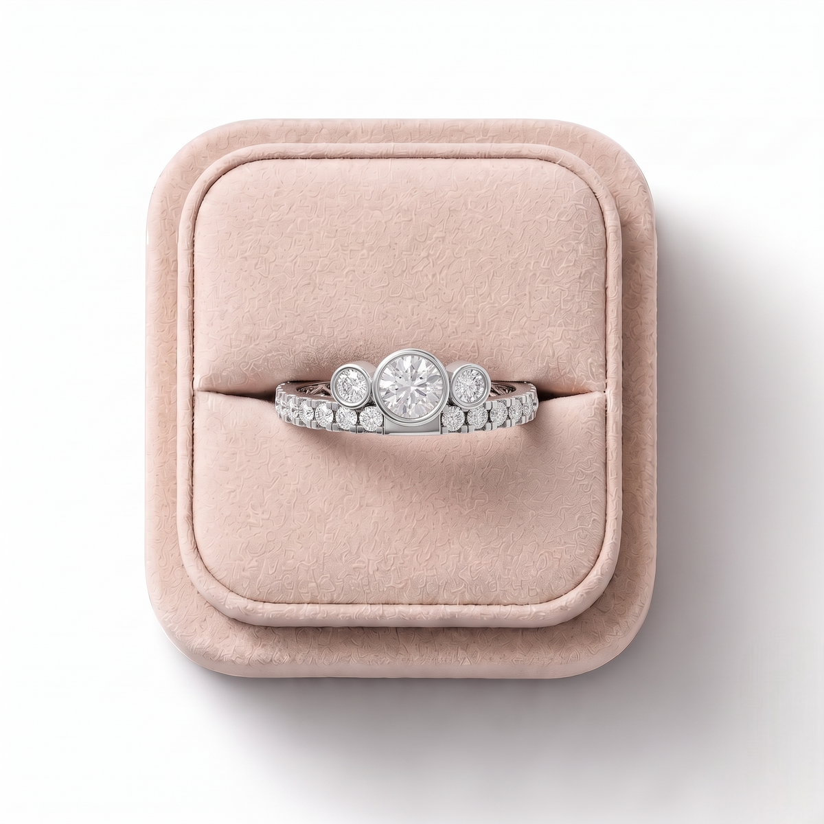 0.29 CT Round Bezel Three-Stone Lab Grown Diamond Ring, on a white background