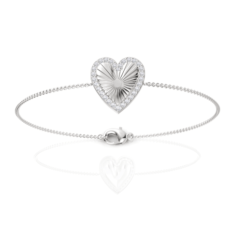 Heart-shaped centerpiece with a radial sunburst texture, surrounded by a pavé halo of round lab-grown diamonds on a delicate 18K gold chain.
