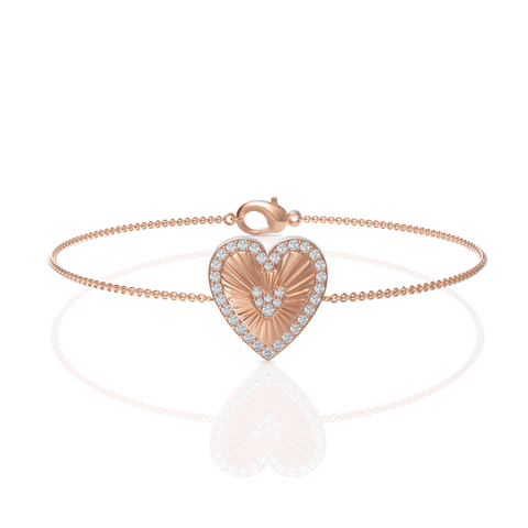 18K gold bracelet featuring a heart design, set with round lab-grown diamonds in a pavé halo, and a sunburst texture.