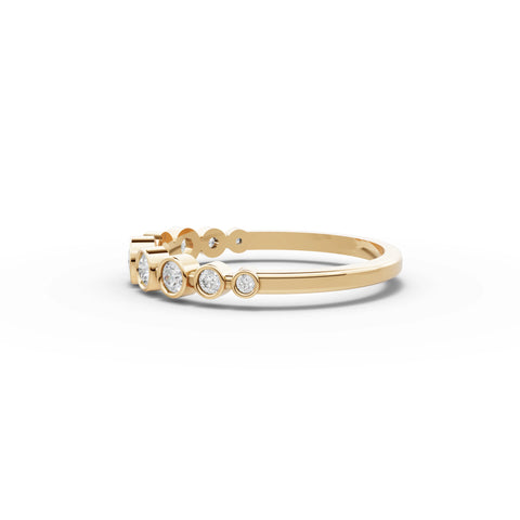0.35 CT Round Bezel Set Half Eternity Lab Grown Diamond Band in yellow gold, angled view
