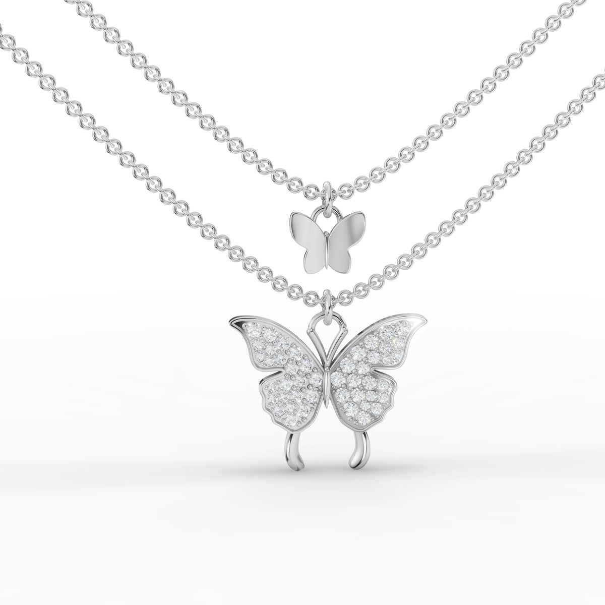 Double butterfly pendant featuring 0.39 CT round brilliant lab-grown diamonds in 18k gold, suspended on a fine link chain.