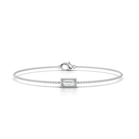 Baguette lab diamond bracelet in 18k gold, featuring a central elongated diamond in a rectangular setting, with a delicate chain.