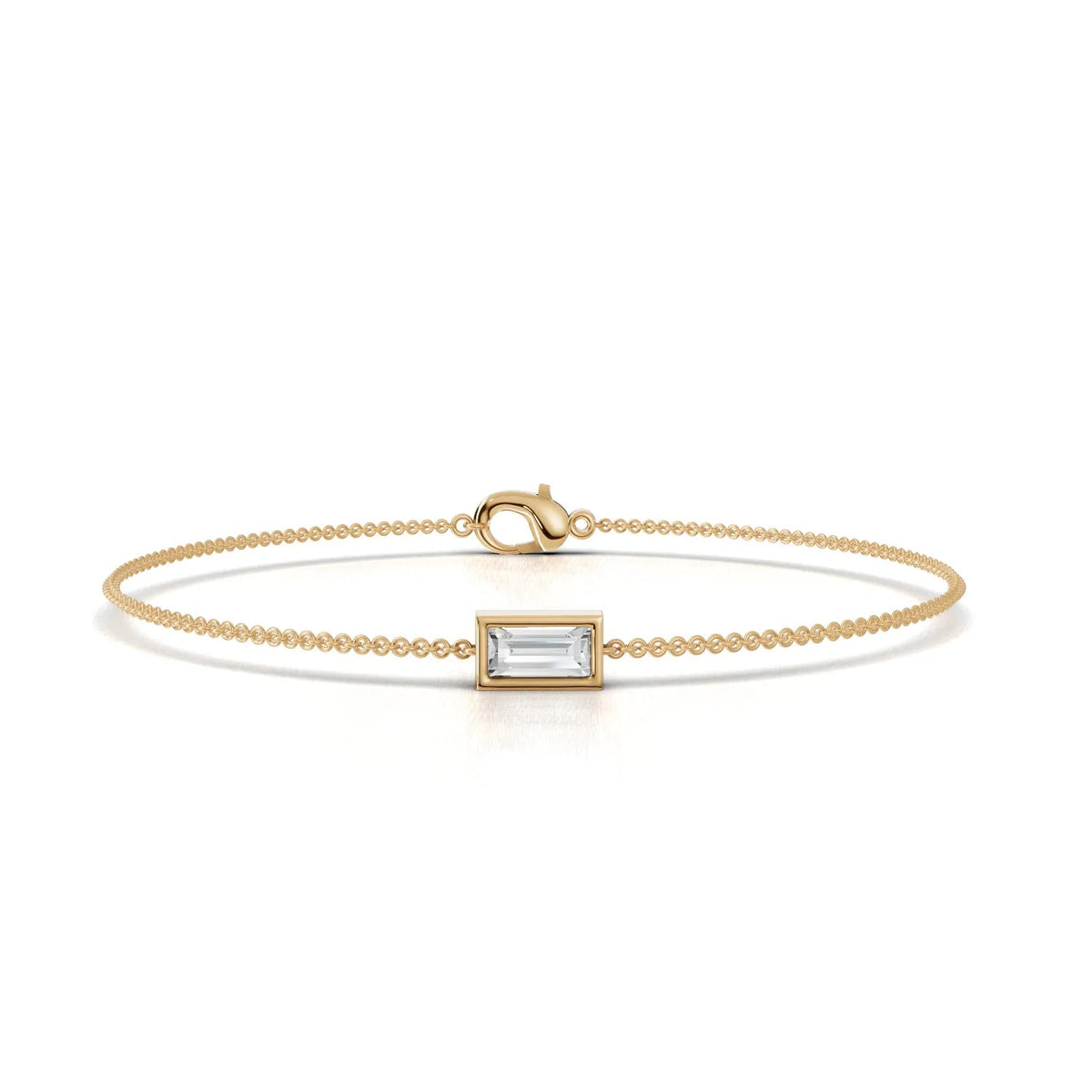 Baguette lab diamond bracelet in 18k gold, featuring a precision-cut center stone and fine articulated chain.