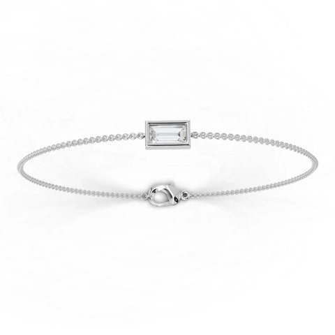 Baguette lab diamond bracelet in 18k gold, featuring a sleek design with a clear rectangular center stone and delicate chain.