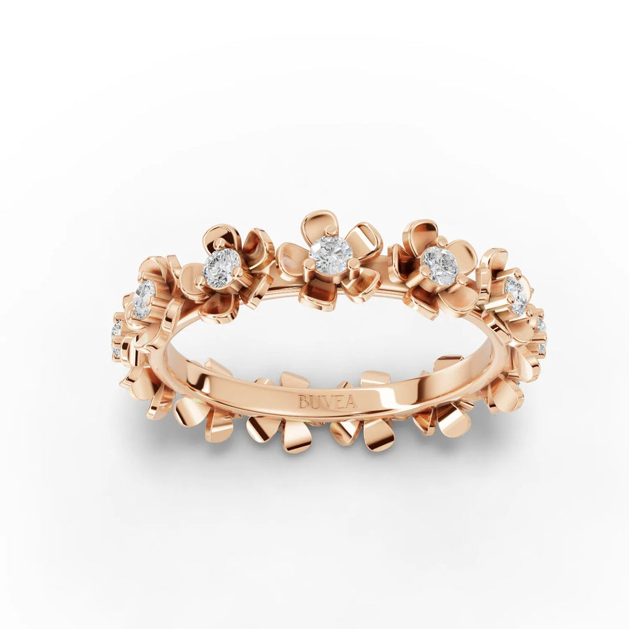 Floral eternity ring crafted in 18K gold, featuring round lab grown diamonds in a delicate flower design.