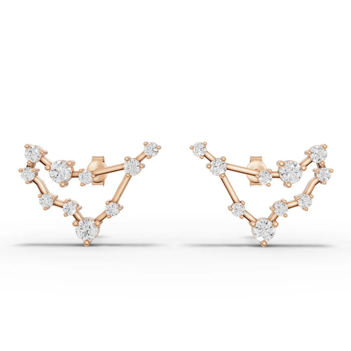 Capricorn constellation earrings featuring round lab grown diamonds in a 18K gold design, showcasing a unique starry profile.