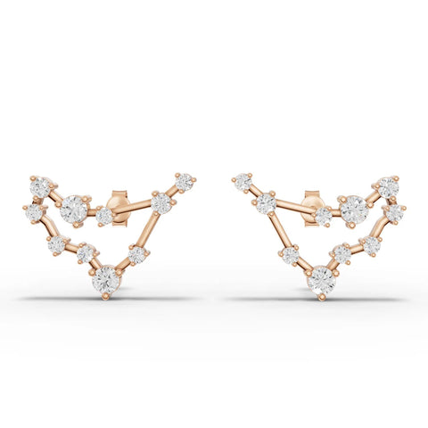 Capricorn constellation earrings featuring round lab grown diamonds in a 18K gold design, showcasing a unique starry profile.