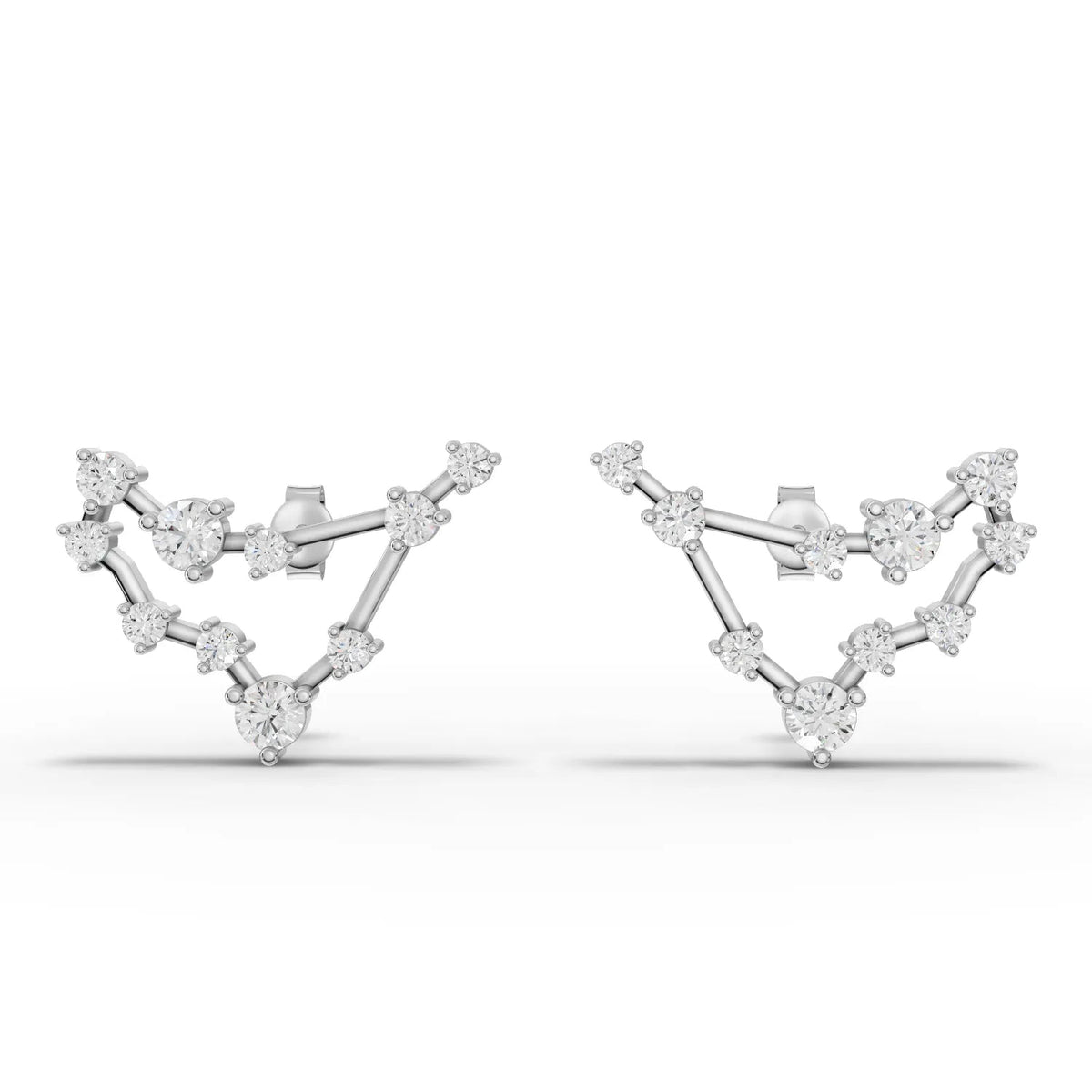 Lab grown diamond earrings featuring a Capricorn constellation design in polished 18K gold, with round diamonds in prong settings.
