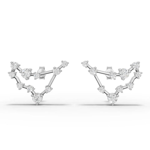 Lab grown diamond earrings featuring a Capricorn constellation design in polished 18K gold, with round diamonds in prong settings.