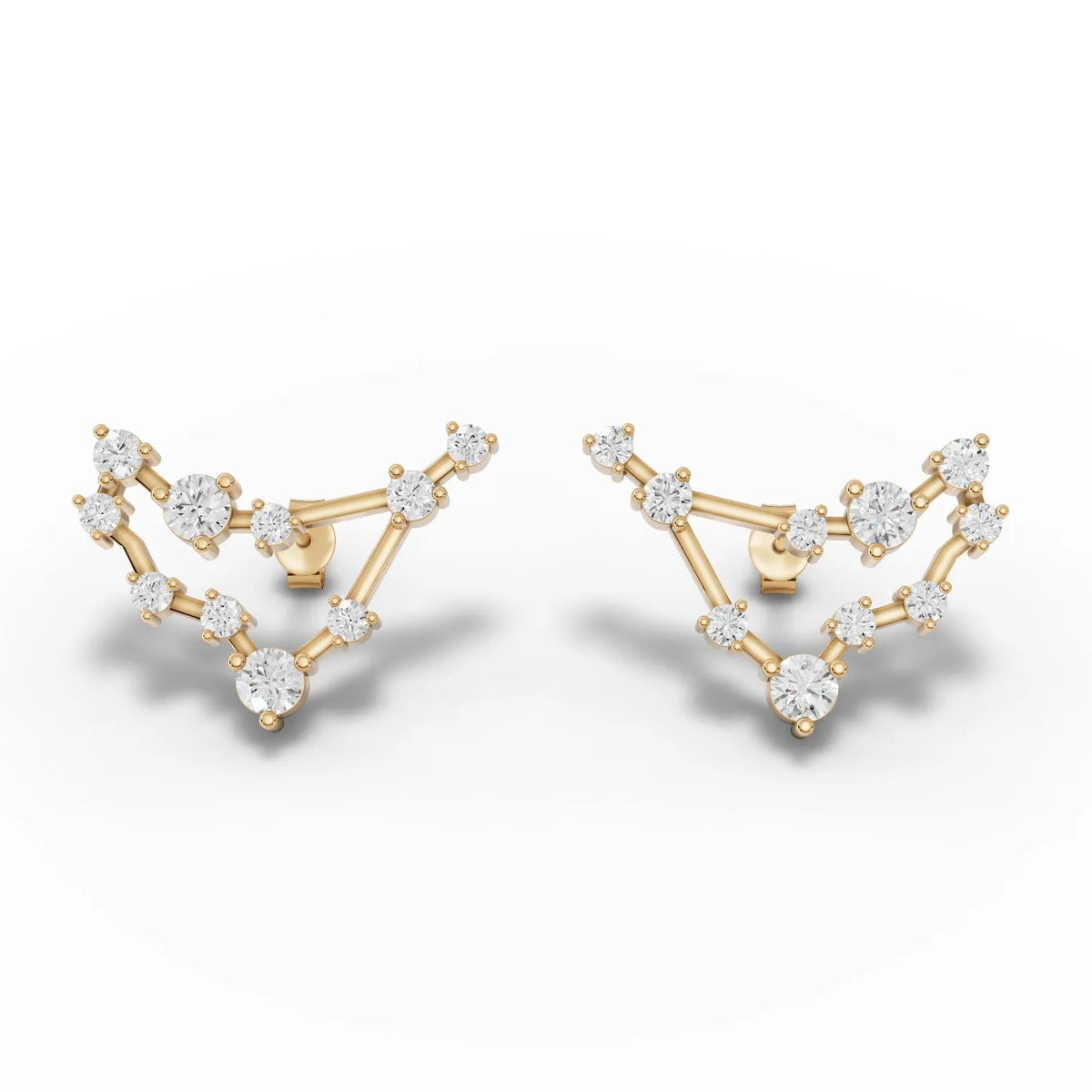 Capricorn constellation earrings featuring round lab grown diamonds set in 18K gold with a distinctive angular design.