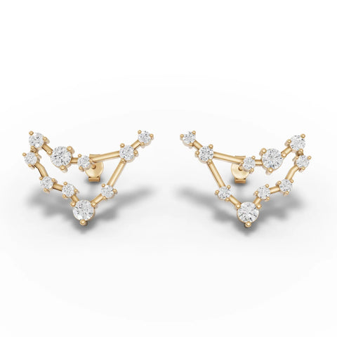 Capricorn constellation earrings featuring round lab grown diamonds set in 18K gold with a distinctive angular design.