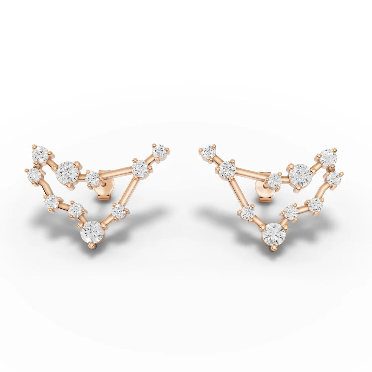 Capricorn constellation earrings featuring round lab grown diamonds set in 18K gold with an angular design and screw backs.