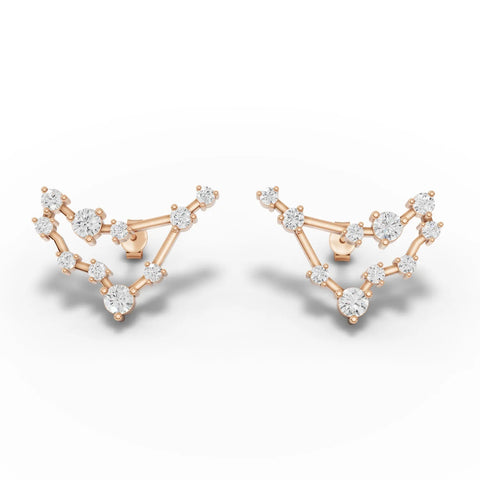 Capricorn constellation earrings featuring round lab grown diamonds set in 18K gold with an angular design and screw backs.