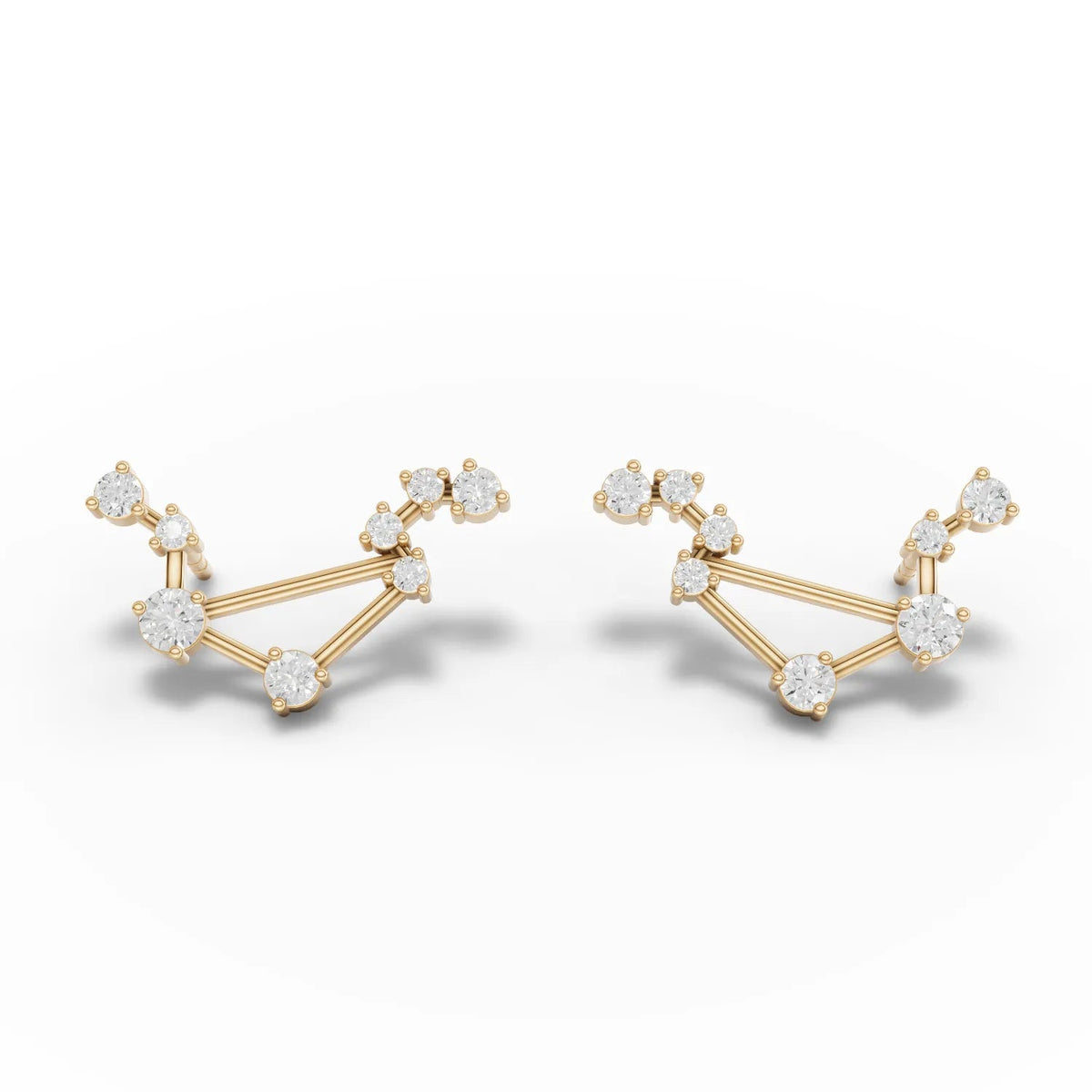 Lab grown diamond earrings featuring a Libra constellation design, set in 18K gold with round stones arranged in a distinctive pattern.