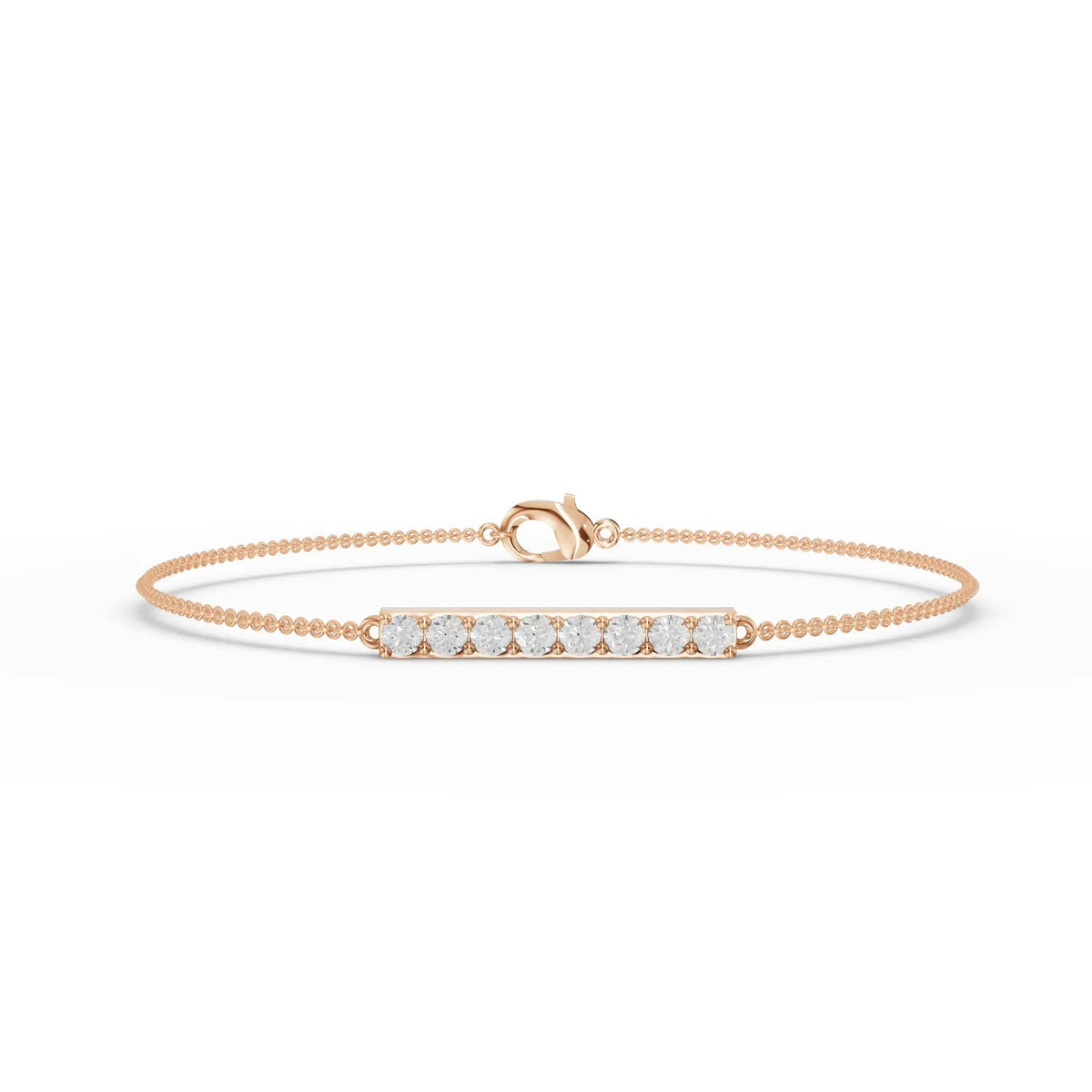 Delicate 18k gold bracelet featuring a linear bar set with round lab-grown diamonds, showcasing even sparkle and minimal design.