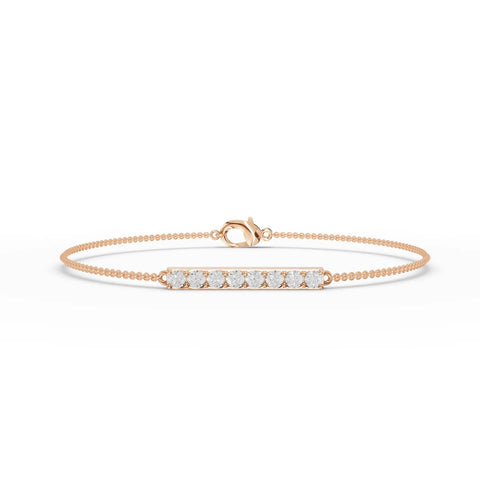 Delicate 18k gold bracelet featuring a linear bar set with round lab-grown diamonds, showcasing even sparkle and minimal design.