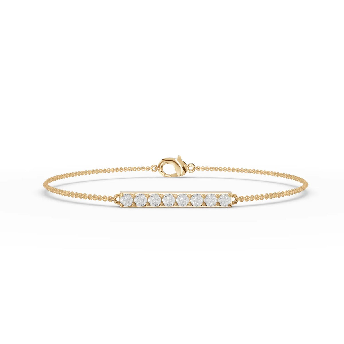 Slim 18k gold bracelet featuring a straight bar of round lab diamonds, showcasing even sparkle and a delicate profile.