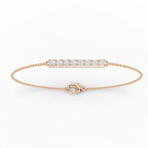 Delicate 18k gold bracelet featuring a horizontal bar set with round lab-grown diamonds for subtle elegance.