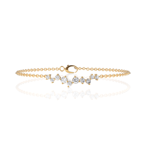 Delicate 18K gold station bracelet featuring a linear cluster of round lab grown diamonds, showcasing a minimalist design.