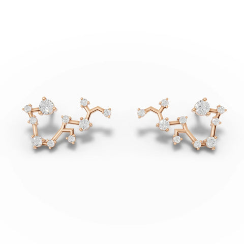 Angular 18K gold earrings featuring round lab-grown diamonds arranged in a Sagittarius constellation design.