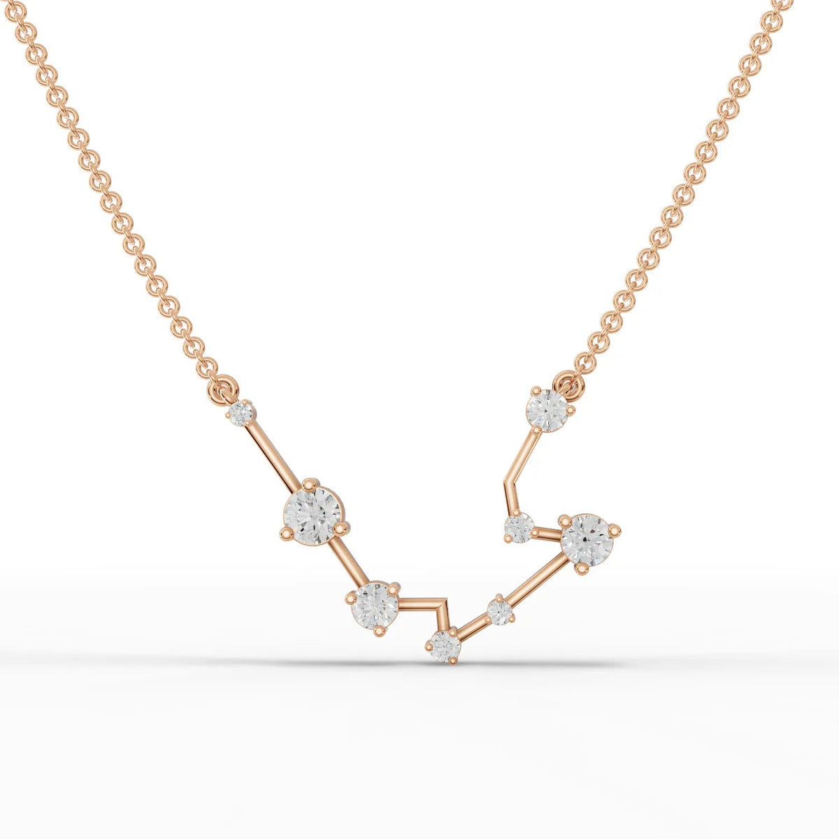 Aquarius constellation pendant featuring round lab grown diamonds on a V-shaped 18k gold chain.