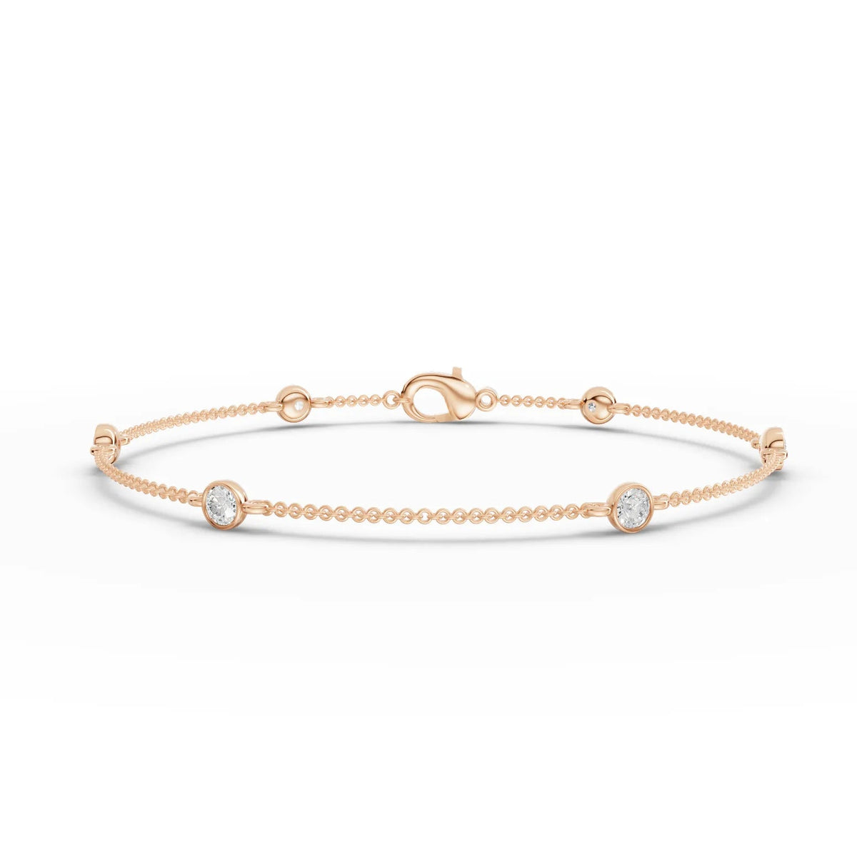 Elegant 0.60 Ct round bezel lab diamond bracelet in polished 18k gold, featuring evenly spaced diamonds and bead links.