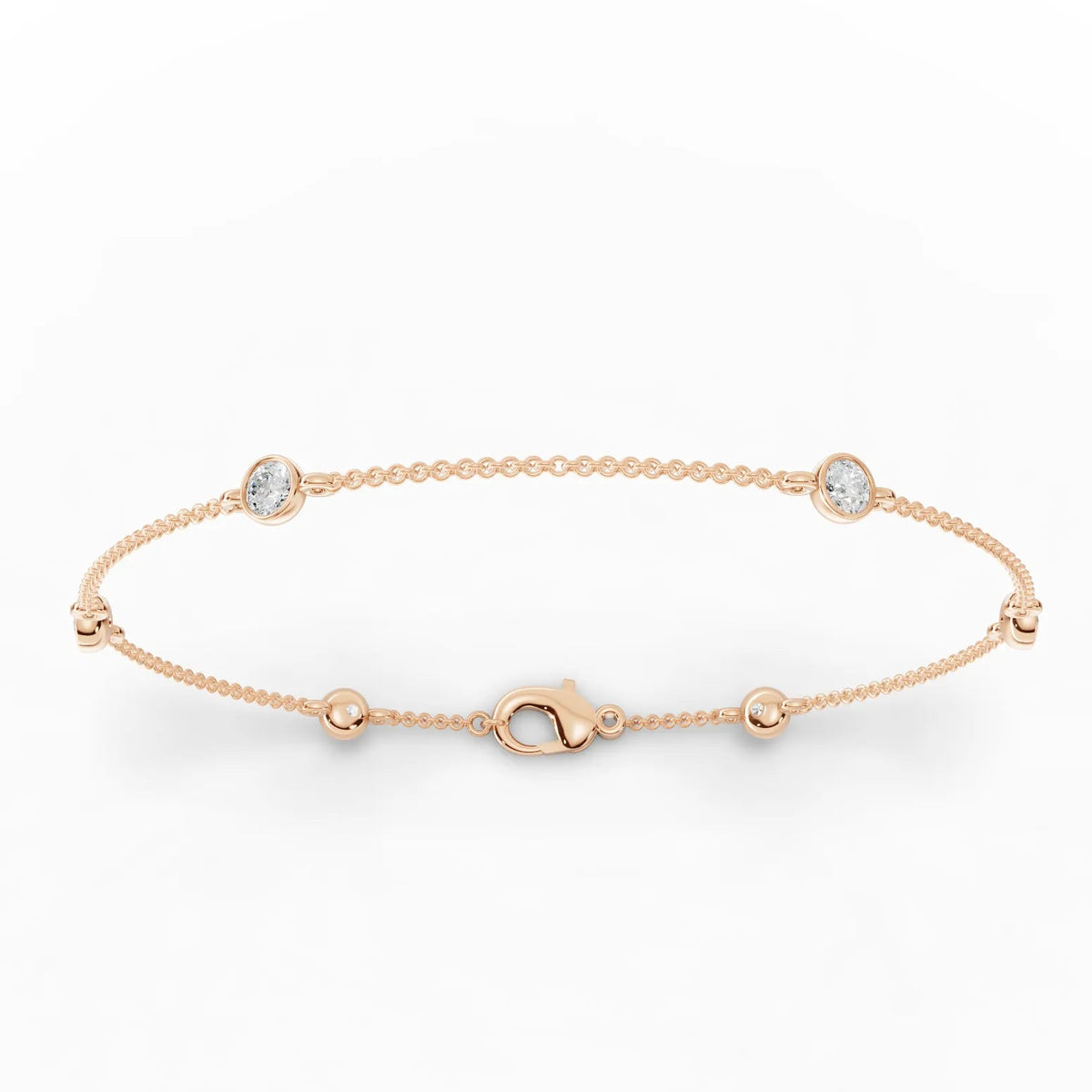 Refined 0.60 Ct round bezel lab diamond bracelet in 18k gold with polished bead links, showcasing a smooth, low-profile design.