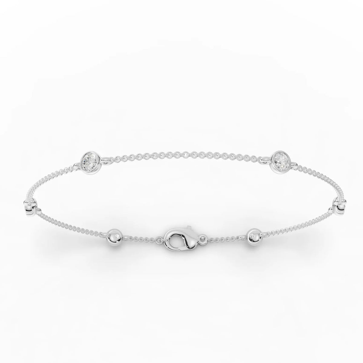 Delicate 0.60 Ct round bezel lab diamond bracelet in 18k gold, featuring polished bead links and a lobster clasp.
