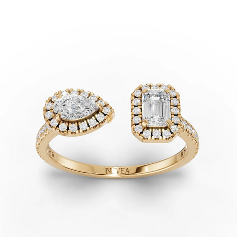 0.60 Ct two stone halo lab diamond ring in 18K gold, featuring a pear and emerald-cut diamond with halo accents.