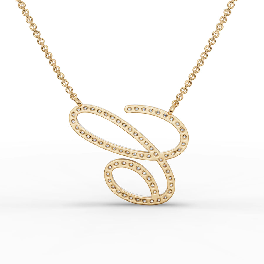 Personalized 0.71 Ct round lab diamond initial pendant in 18k gold with a delicate micro-prong setting and fine link chain.