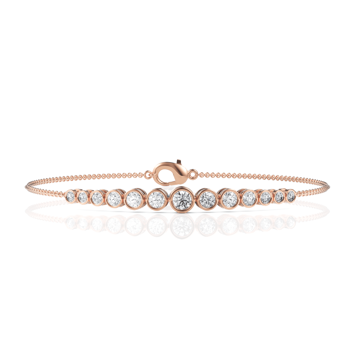 Slender 18k gold chain bracelet featuring graduated round lab-grown diamonds in precision bezel settings, with a lobster clasp.