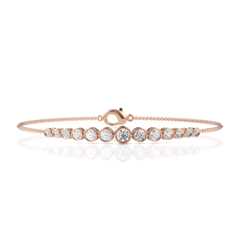 Slender 18k gold chain bracelet featuring graduated round lab-grown diamonds in precision bezel settings, with a lobster clasp.
