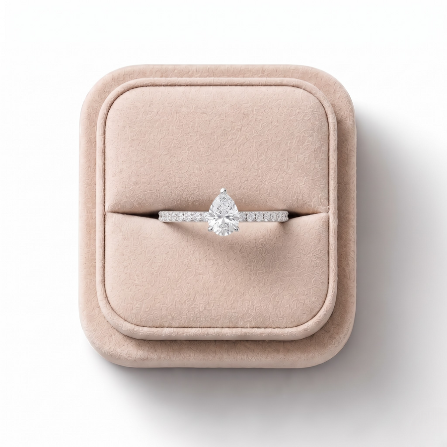 0.98 CT Pear Hidden Halo Pavé Lab Grown Diamond Ring, on a white background