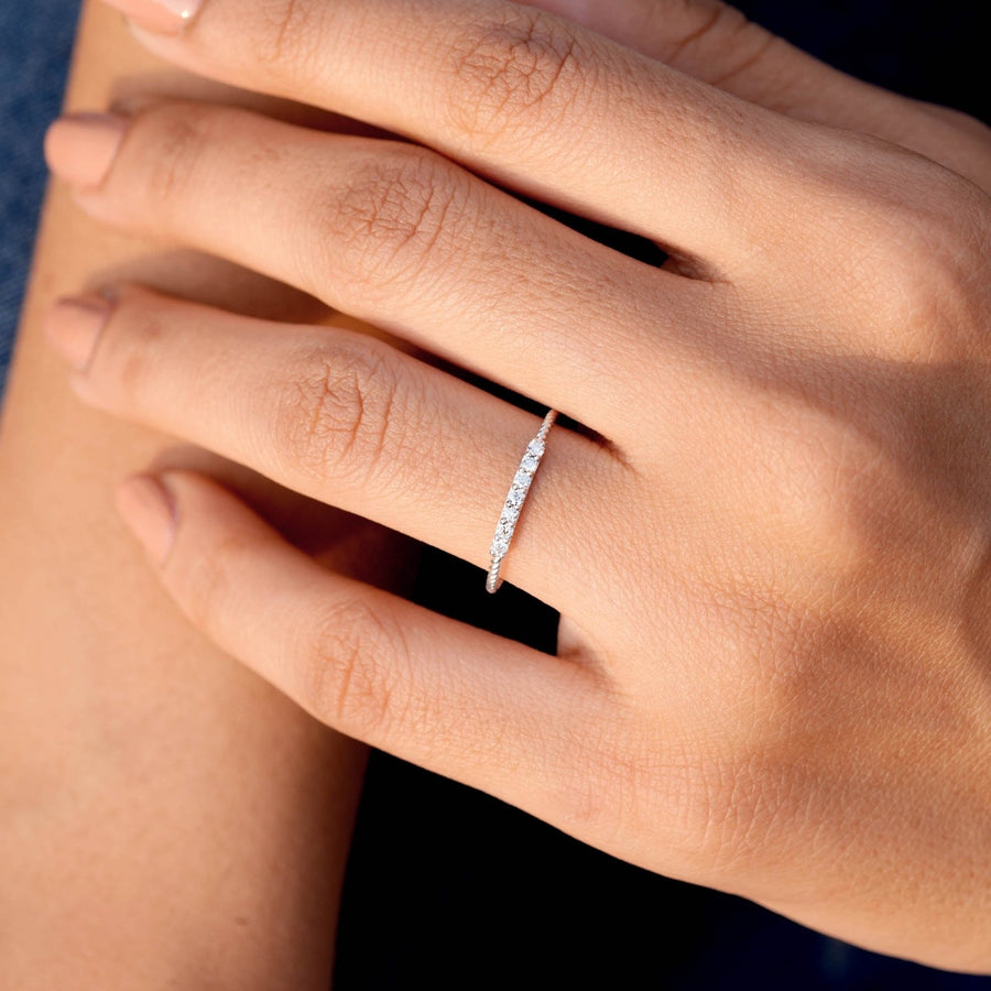 0.12 CT twisted band diamond ring worn on hand