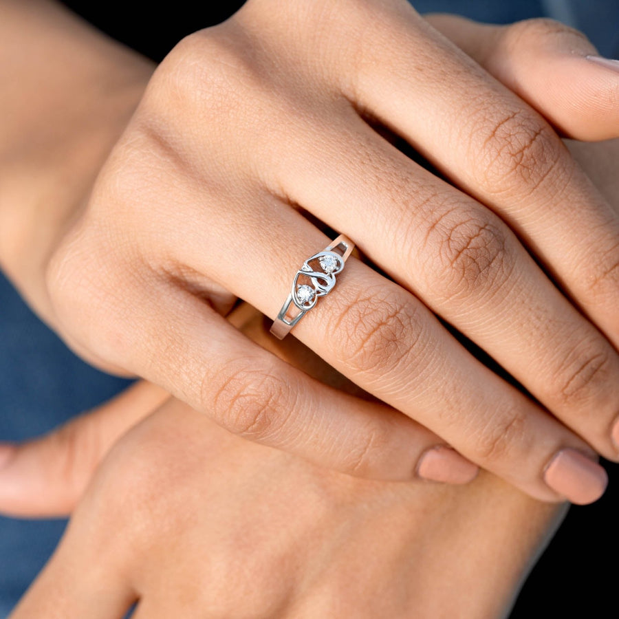 0.14 CT dual-heart diamond ring worn on hand