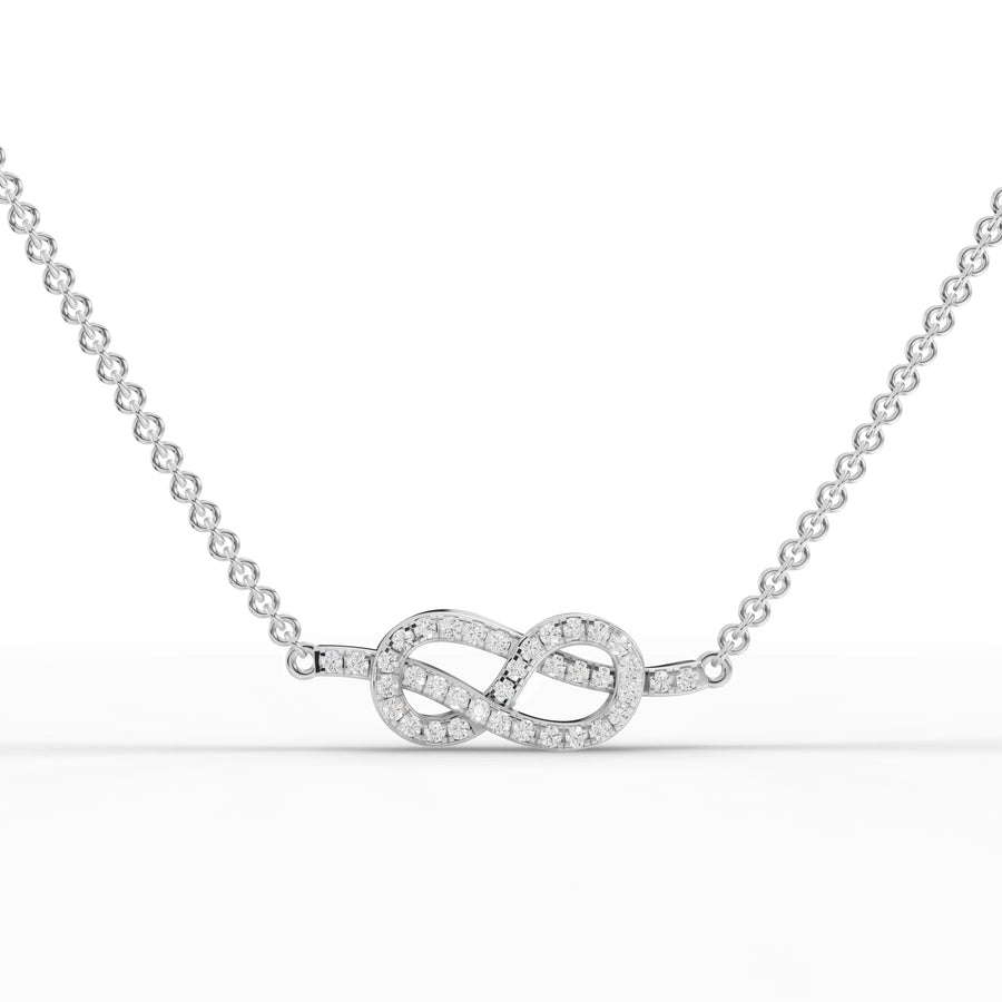0.19 CT infinity pavé lab grown diamond pendant in 18K gold with interwoven heart design and round diamonds