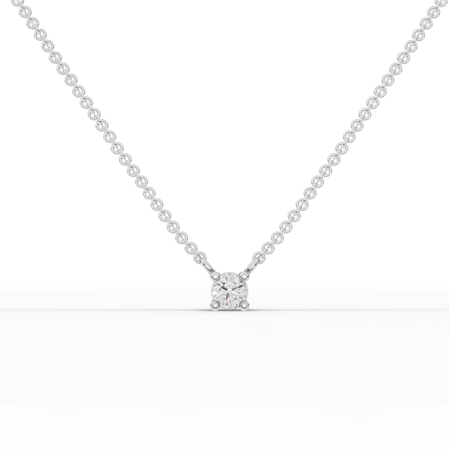 0.25 ct round lab grown diamond solitaire pendant necklace with four-prong setting on a gold chain