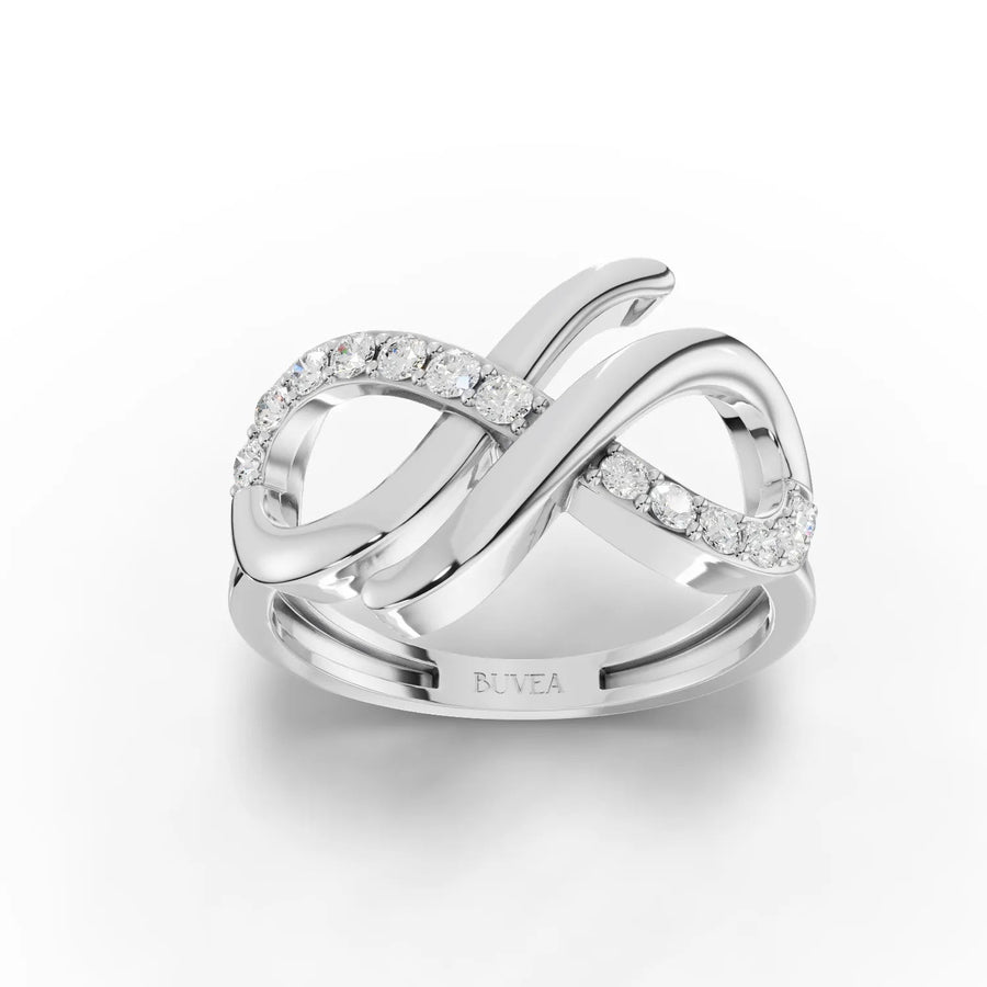 0.26 CT infinity loop lab diamond ring in 18K gold with round pavé accents and open figure-eight design