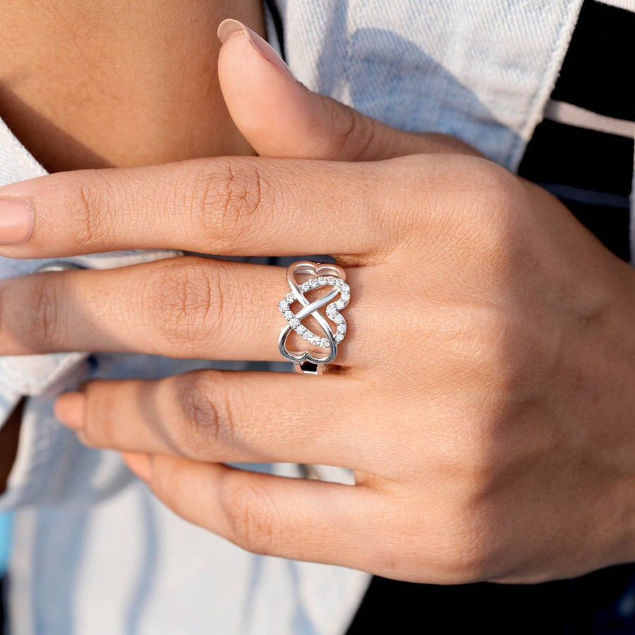 0.29 CT heart motif diamond ring worn on hand