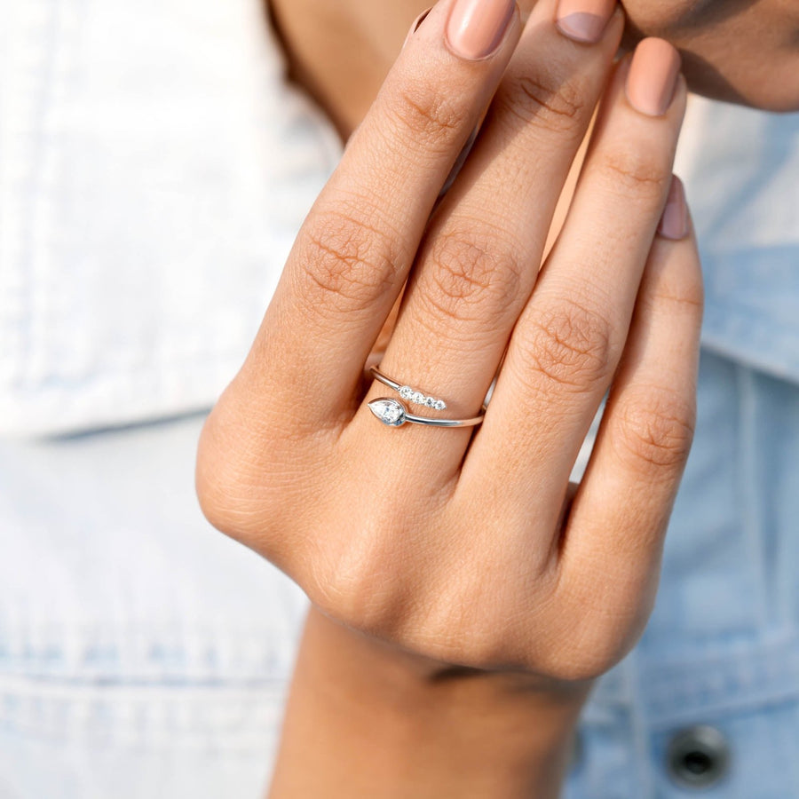 0.34 CT open-band diamond ring worn on hand