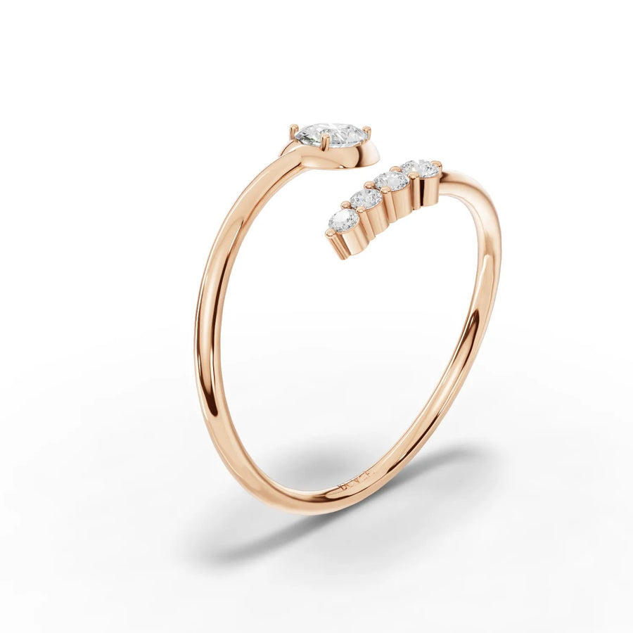 Pear diamond and round stones rose gold close-up