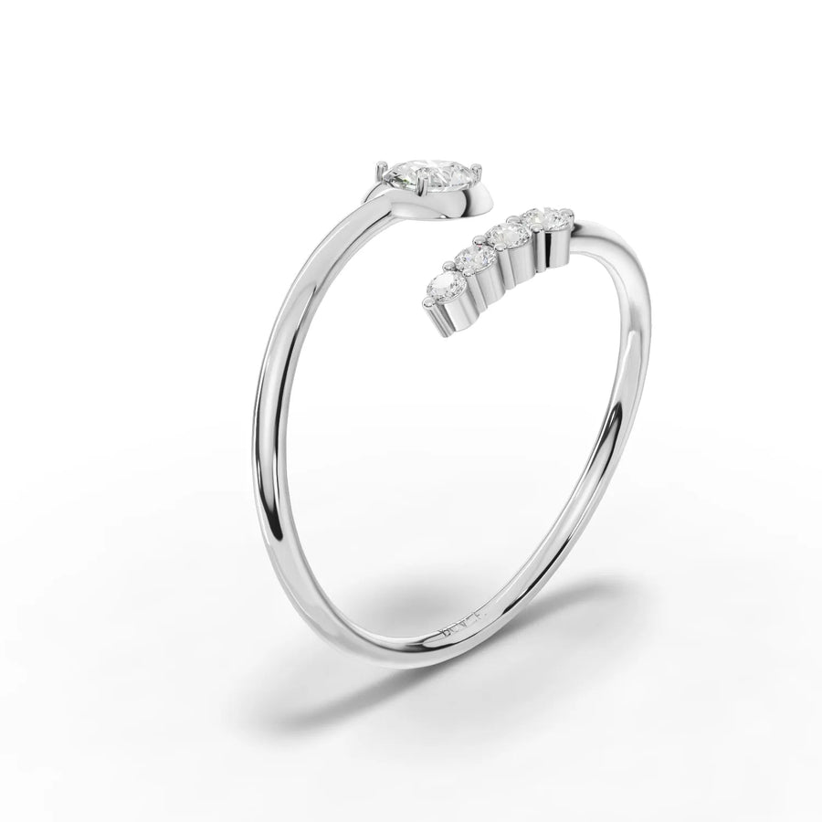 Pear diamond and round stones white gold close-up
